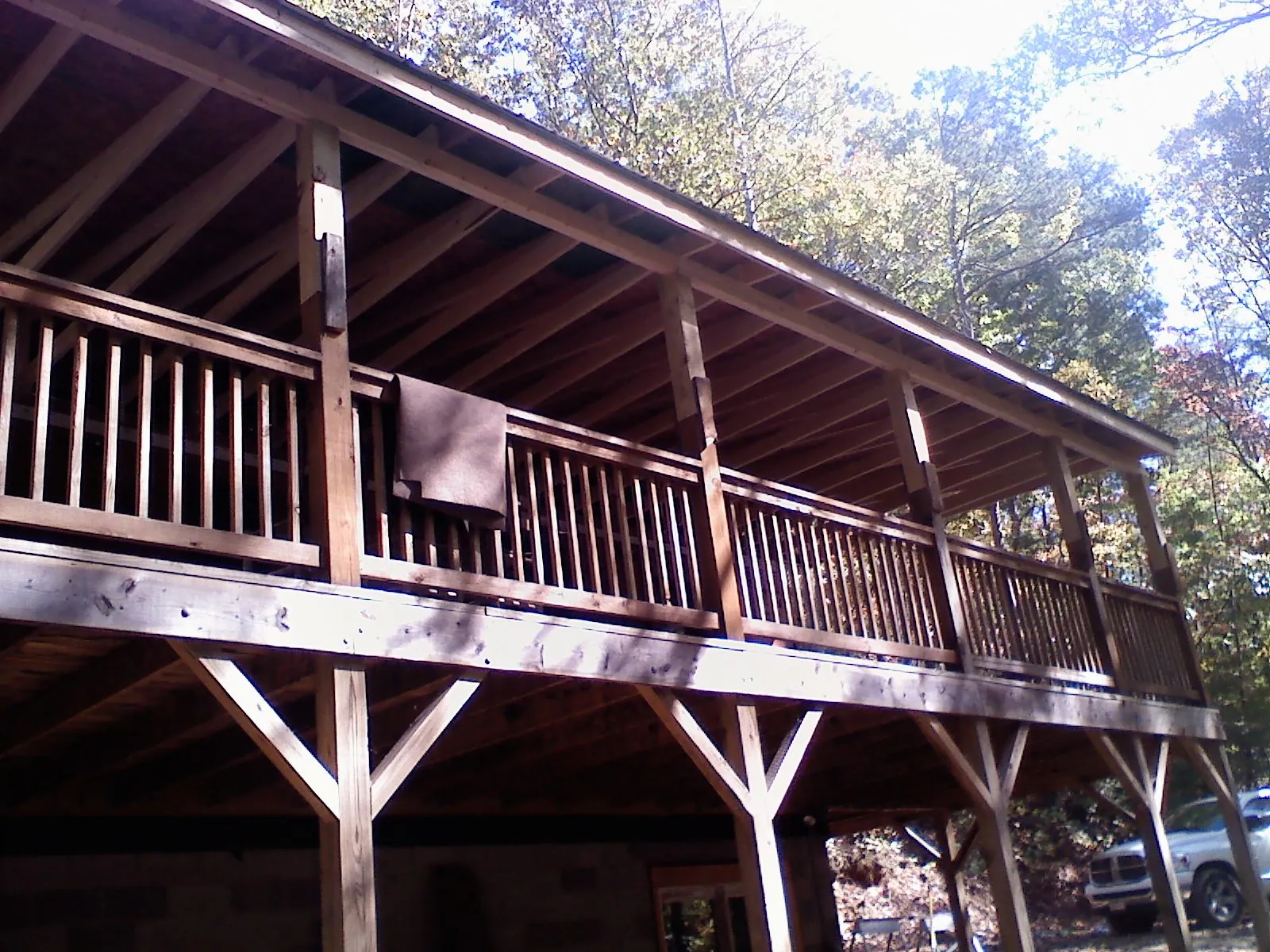 Timber framing under a new elevated porch and deck — Roof Leak Repair in Corona by Roofing Brothers